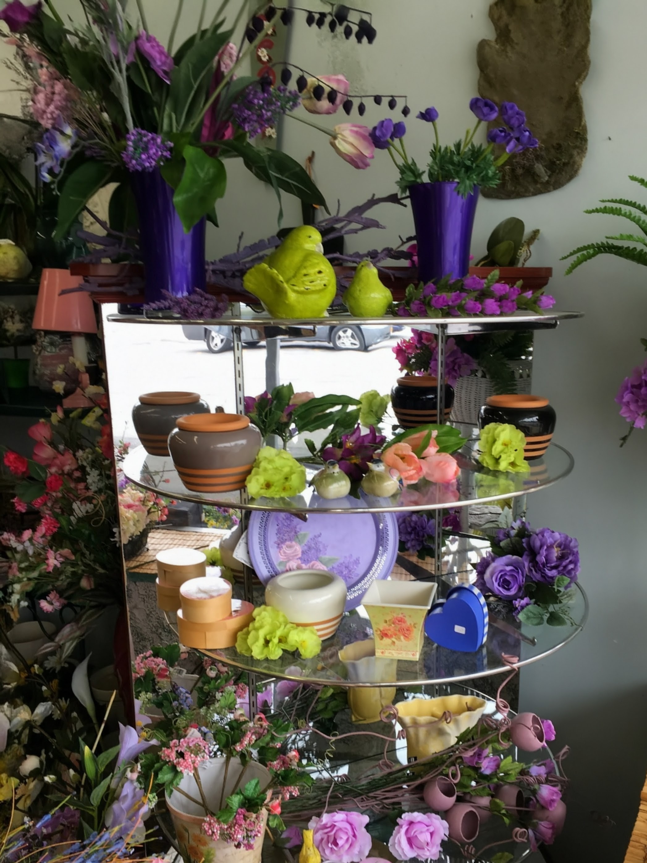 Shelf of assorted flowers and gifts